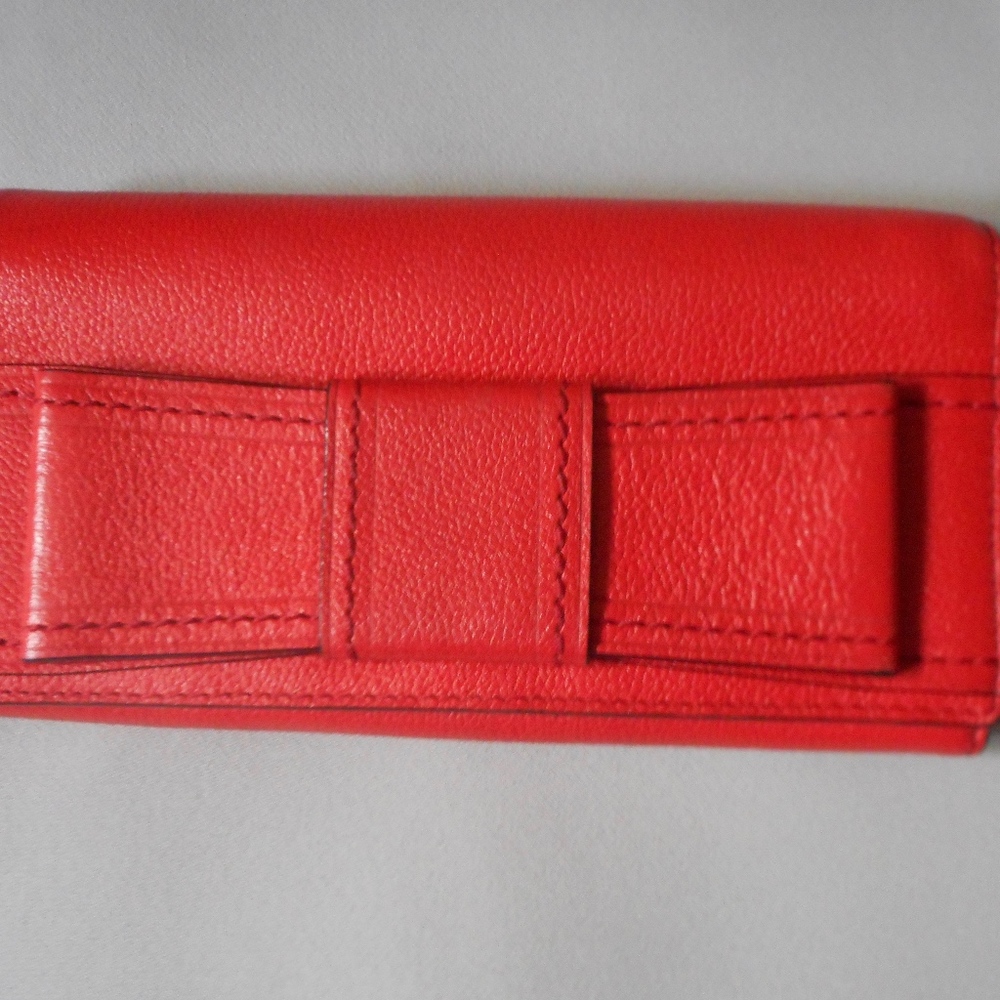Red Kate Spade wallet with bow